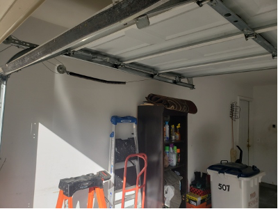 Interior view of a garage highlighting the door mechanism, ready for Brentwood’s expert repair services.