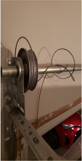 Garage door pulley and cable system, part of Brentwood Garage Door Services' expertise.